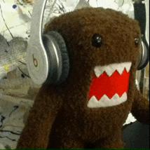a stuffed animal wearing a pair of headphones with the letter b on them