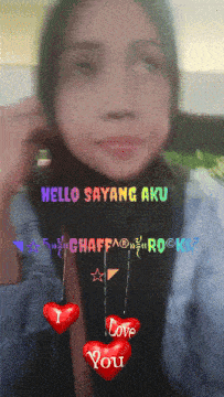 a picture of a woman with the words hello sayang aku written on it