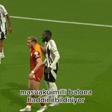 two soccer players on a field with the words masaaku milli balona haddini bildiriyor