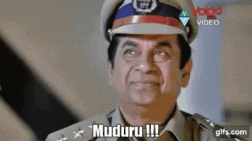 a man in a police uniform is making a funny face and saying muduru !!