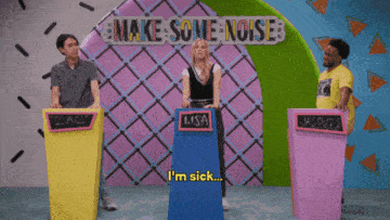 a group of people standing in front of a sign that says make some noise