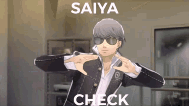 a man wearing sunglasses is making a check sign