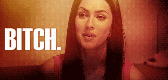 a woman in a red tank top says bitch in white letters