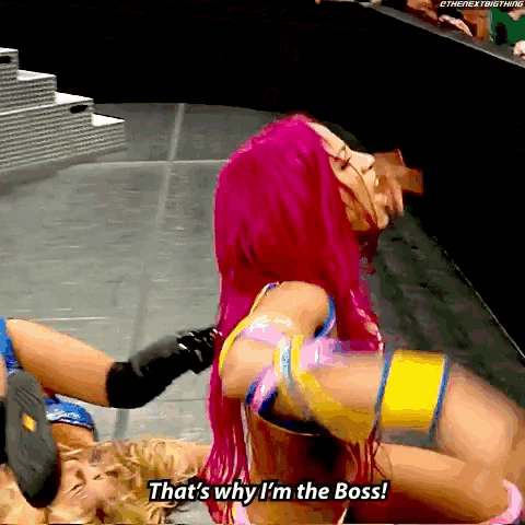 a female wrestler with pink hair says " that 's why i 'm the boss "