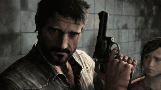 a man with a beard holds a gun in his hand