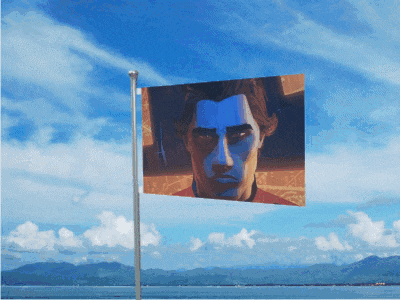 a flag with a man 's face on it flies in the wind