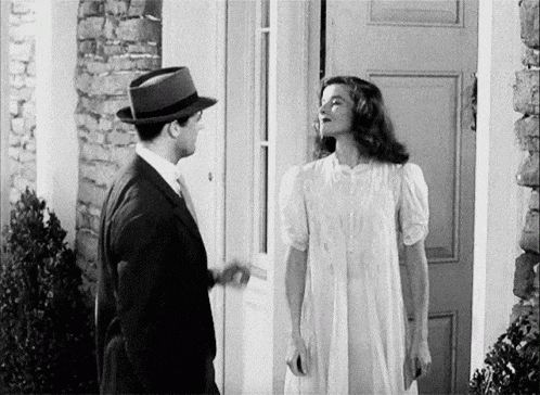 a black and white photo of a man and a woman
