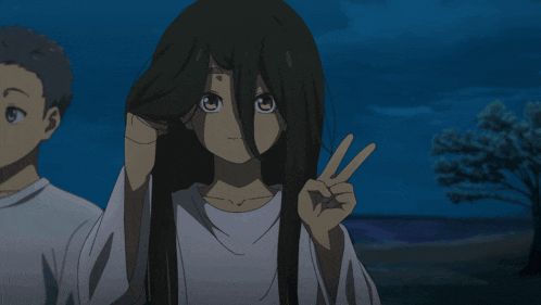 a girl is giving a peace sign while standing next to a boy