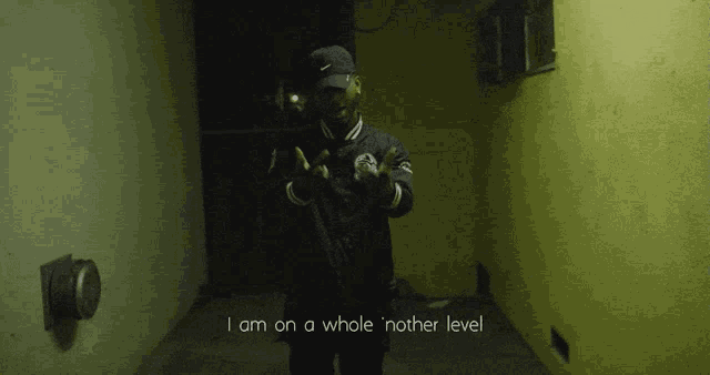 a man standing in a dark room with the words i am on a whole nother level