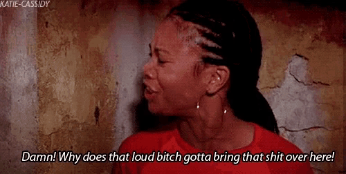 a woman in a red shirt is crying and saying damn why does that loud bitch gotta bring that shit over here