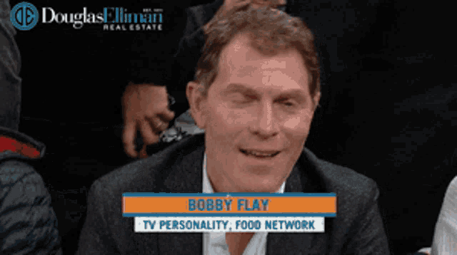 a man named bobby flay is on a tv personality food network