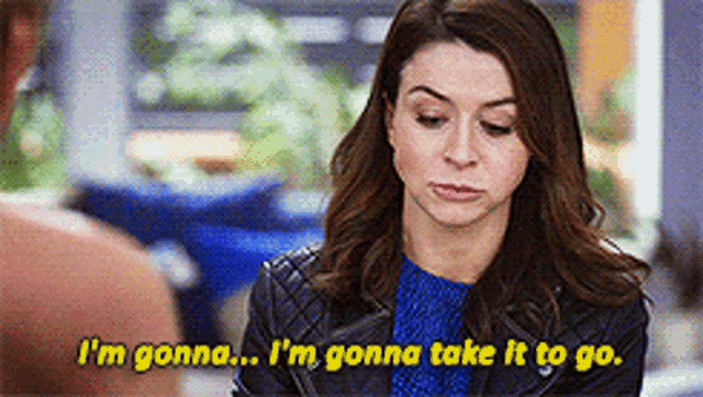 a woman is talking to a man and says i 'm gonna take it to go