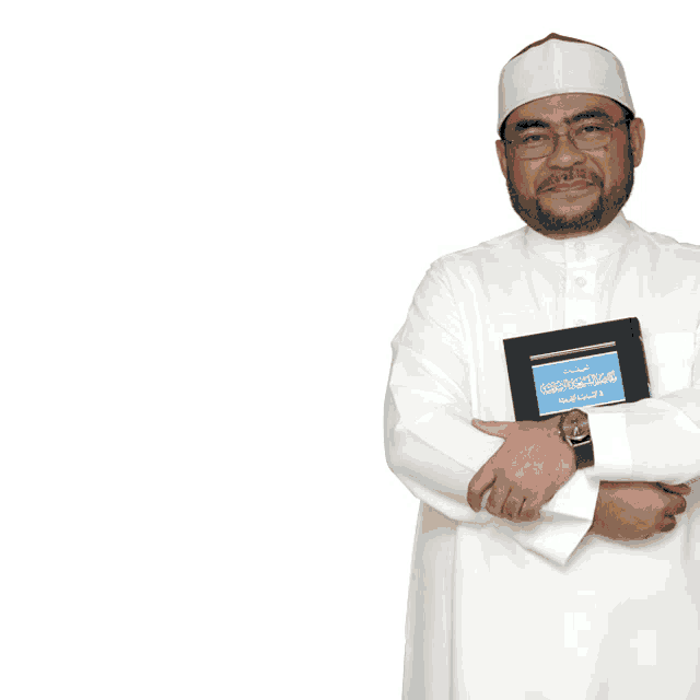 a man in a white robe stands in front of a sign that says islam rahmatan lil ' alamin #rahmah