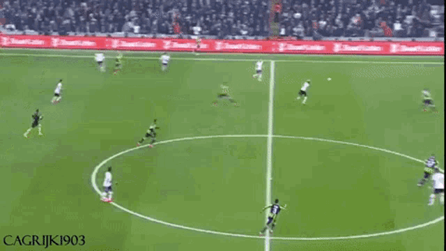 a soccer game is being played on a field with advertisements for ziraat written on the sidelines