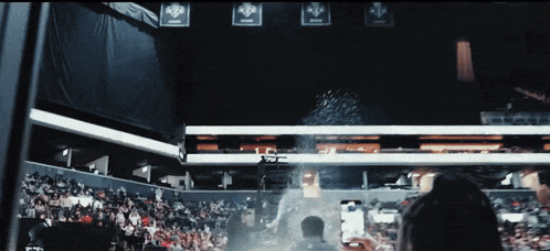 a man is taking a picture of a crowd at a stadium