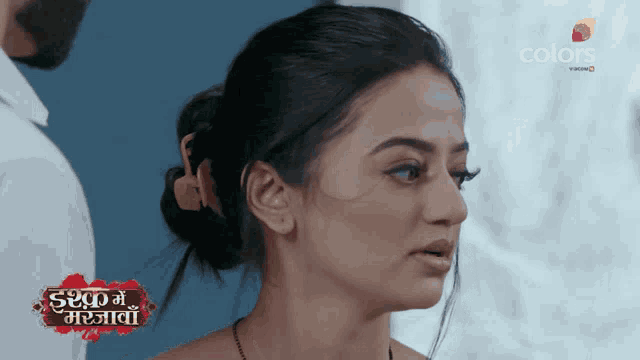 a close up of a woman 's face with the words colors in the corner