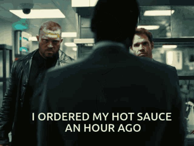 a man in a suit says i ordered my hot sauce an hour ago in a dark room