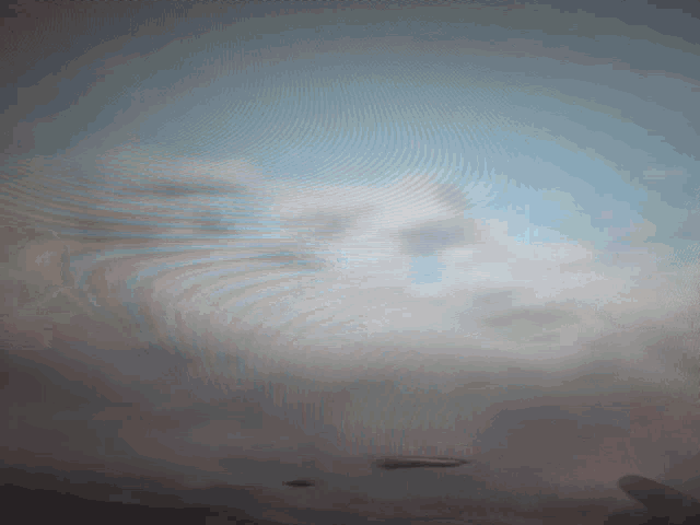 a blurred image of a person 's face with a blue background