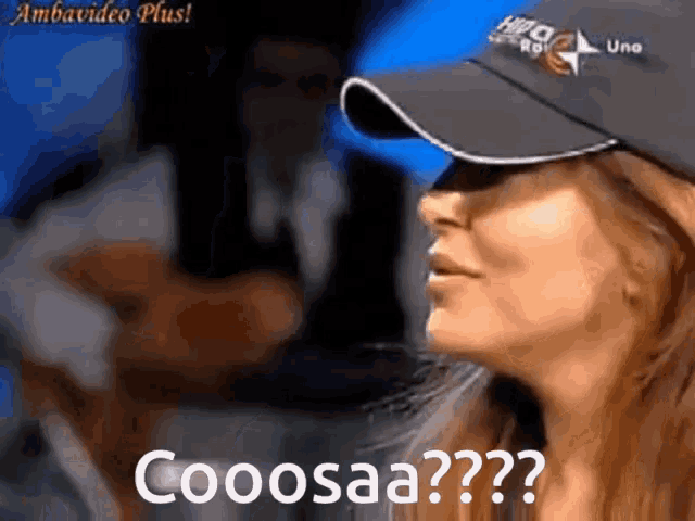 a woman wearing a baseball cap says cooosa??