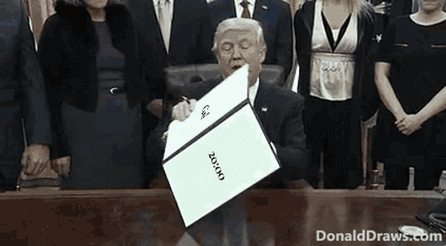 a man in a suit is signing a document that says goose