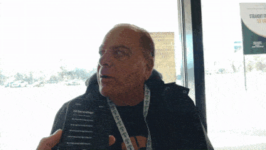 a man holding a cell phone that says all recordings