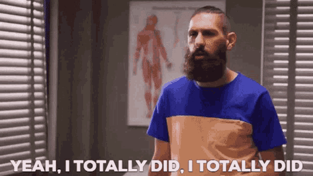 a man with a beard is saying yeah i totally did