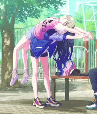 a girl in a pink shirt with the letter e on it is holding another girl on her back