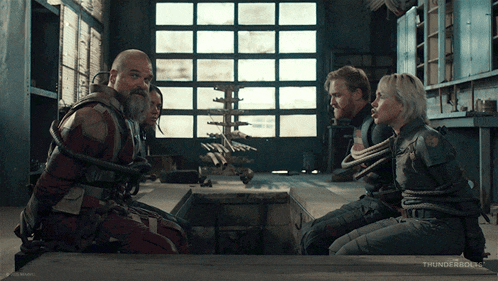 a group of people are tied up in a room with the word thunderbolts on the bottom