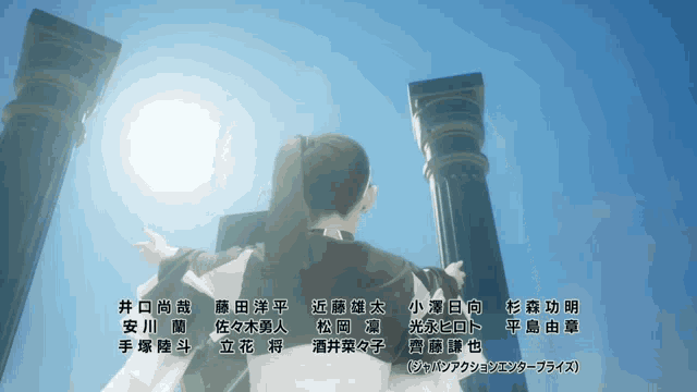 a woman stands in front of two columns with chinese writing on it