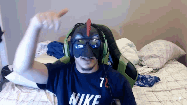 a man wearing a mask and headphones has a nike shirt on
