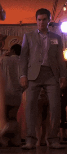 a man in a suit with a name tag that says ' chris '