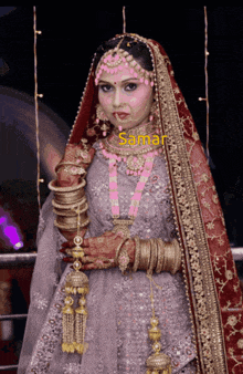 a woman in a wedding dress has the name samar written on the bottom right