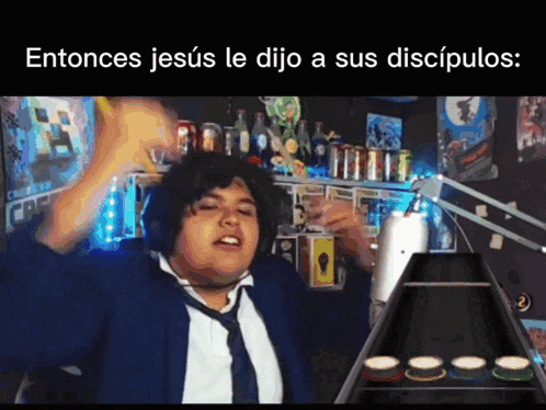 a man in a suit and tie is playing a guitar with the words entonces jesús le dijo a sus discipulos above him