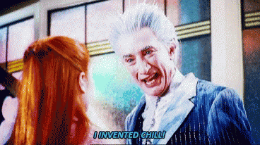 a man with white hair is talking to a woman and says i invented chilli .