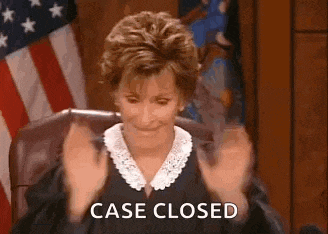 a judge is sitting in a courtroom with her hands in the air and the words `` case closed '' .