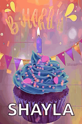 a purple cupcake with blue frosting and a lit candle with the name shayla