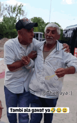 two men are standing next to each other with the caption " tambi ala gavat ya " on the bottom