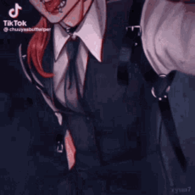 a man in a suit and tie is taking a selfie with a microphone .