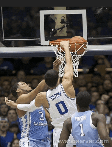 a basketball game is being played between two teams one of which is from carolina