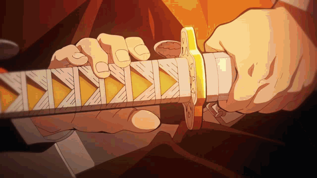 a close up of a person holding a sword with a triangle pattern
