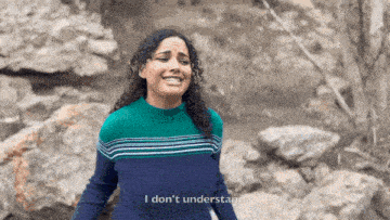 a woman in a blue and green striped sweater says i don 't understand