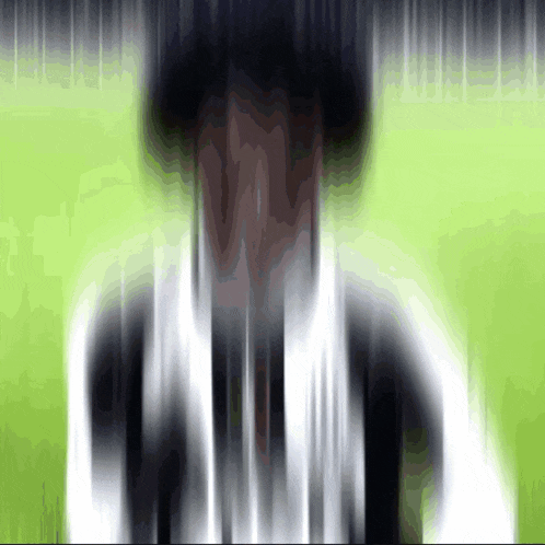 a blurred image of a person 's face with a green background