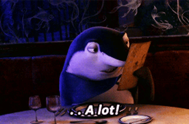 a shark is sitting at a table with a sign that says " a lot "