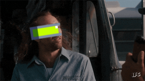 a man in a prison uniform has a green block on his eye