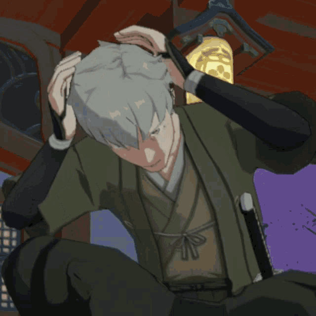 a man in a green kimono is holding his hair
