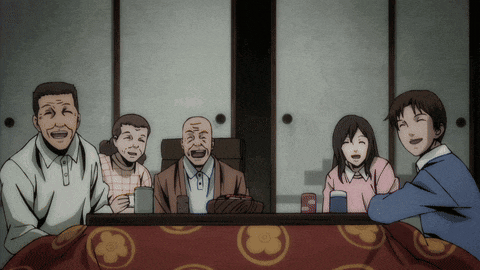 a group of people sitting around a table with a can of coca cola