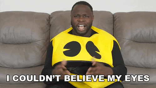 a man in a pac man costume is sitting on a couch and says i couldn t believe my eyes