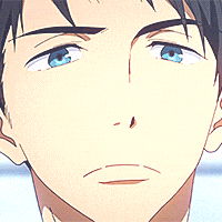 a close up of a boy 's face with blue eyes