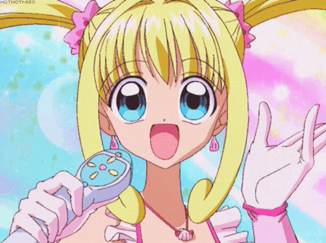 a girl with blonde hair is singing into a microphone with the words hothotmiso below her