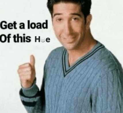a man in a blue sweater is giving a thumbs up with the words get a load of this hoe behind him .